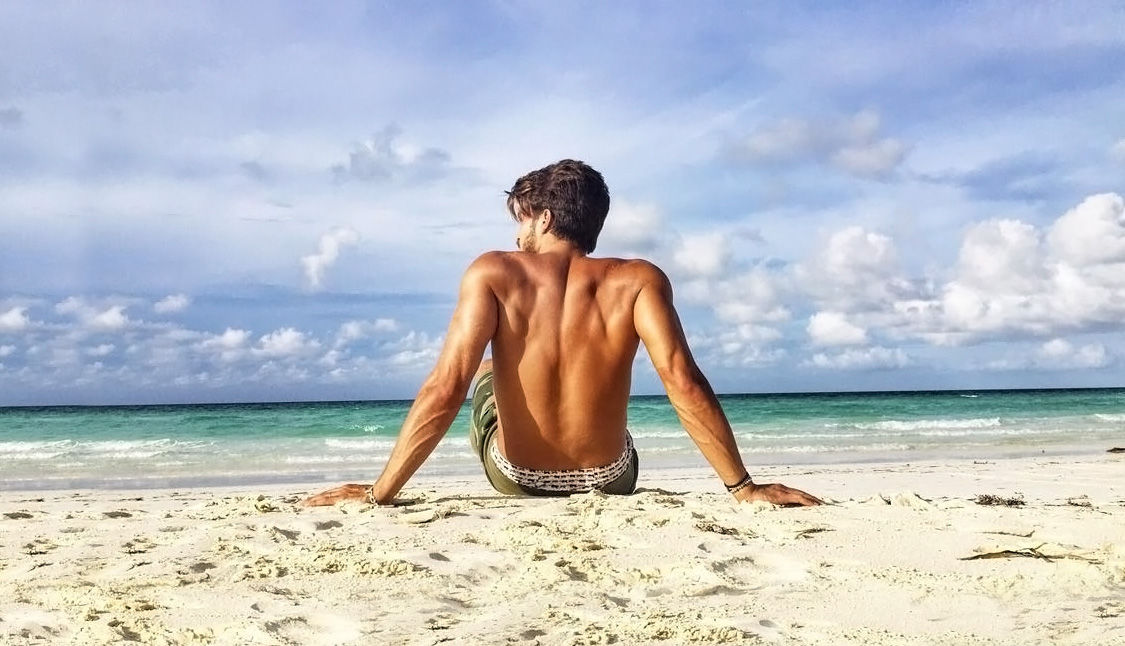 Posing for a camera. Young european man have vacation and enjoying free  time on the beach of sea 15362565 Stock Photo at Vecteezy