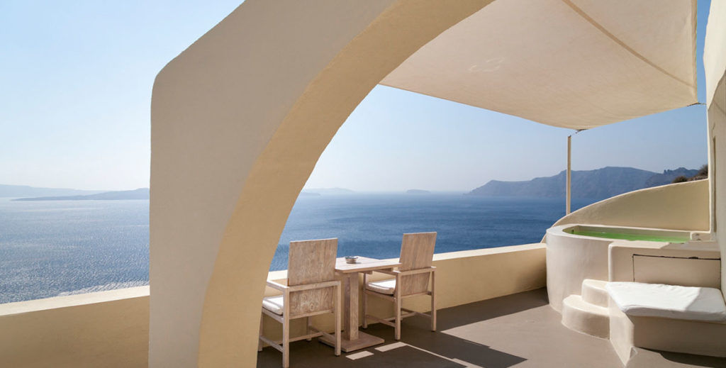 Bathtub overlooking the Aegean Sea at Mystique hotel, Santorini, Greece