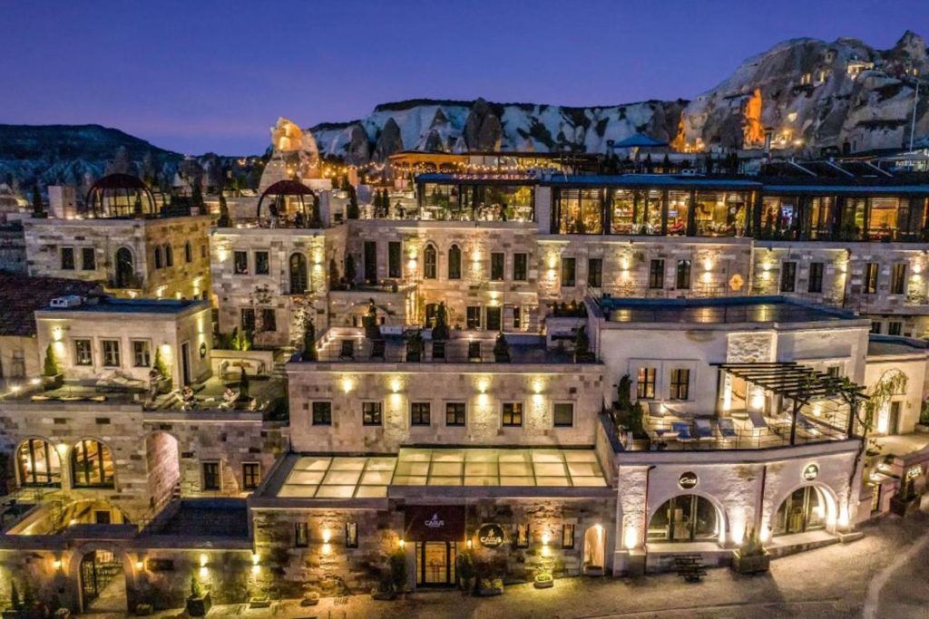 Watch the balloons float overhead at... Carus Cappadocia