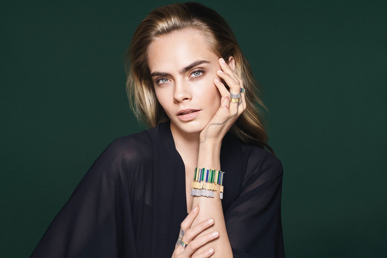 Stack Gem Dior bangles for a striking look