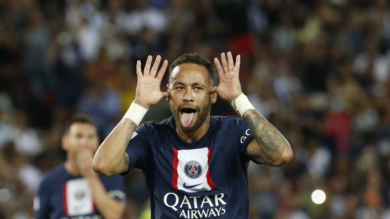 Brazilian football star Neymar, or Neymar Jr., poses as he arrives