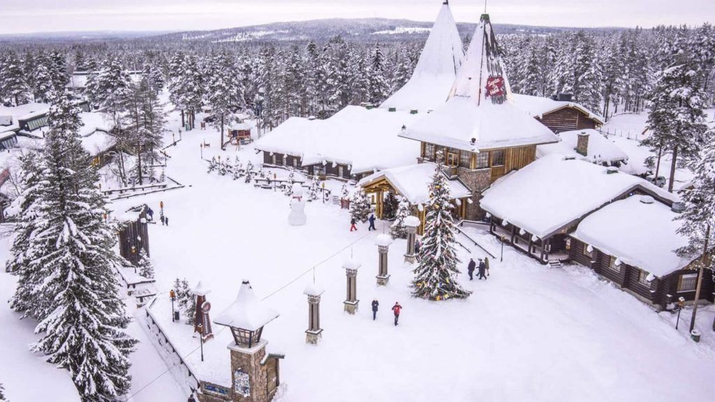 Hop on a sleigh and dash through the snow at the Santa Claus Village in Finland