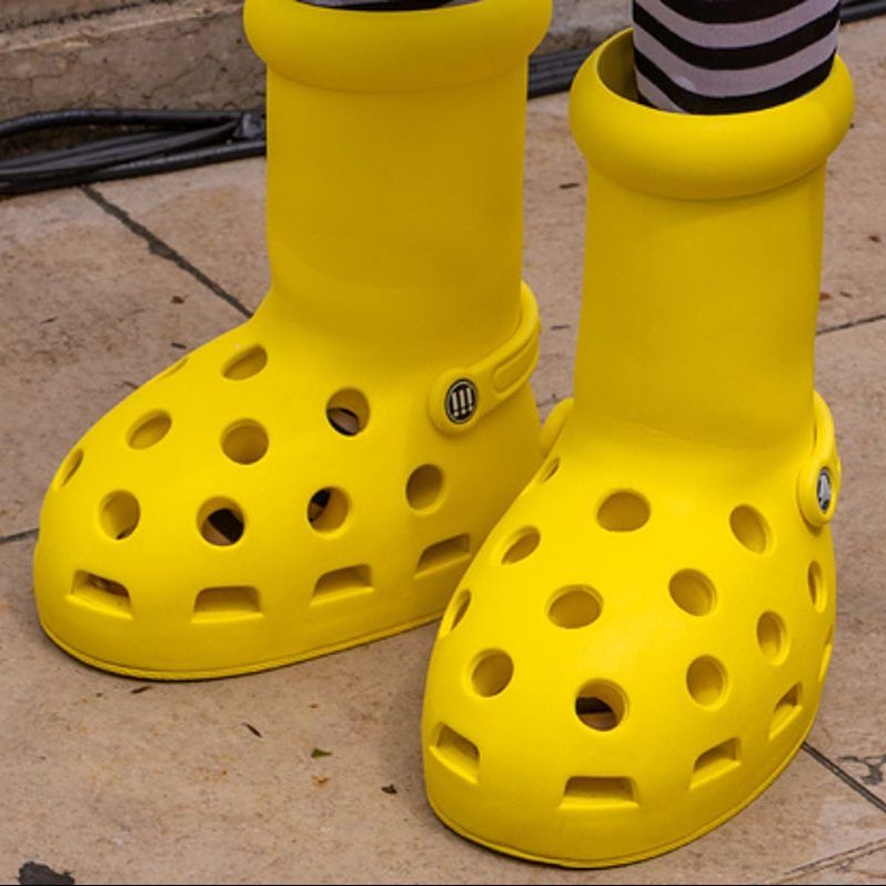 MSCHF And Crocs Reveal Big Yellow Boots At Paris Fashion Week