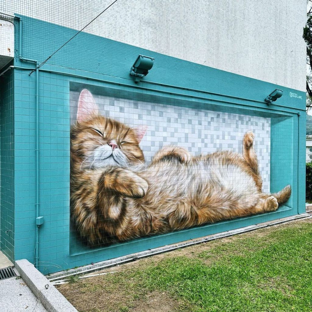 Vladimir Boldyrev paints “Lazy Mural Cat” before leaving Hong Kong