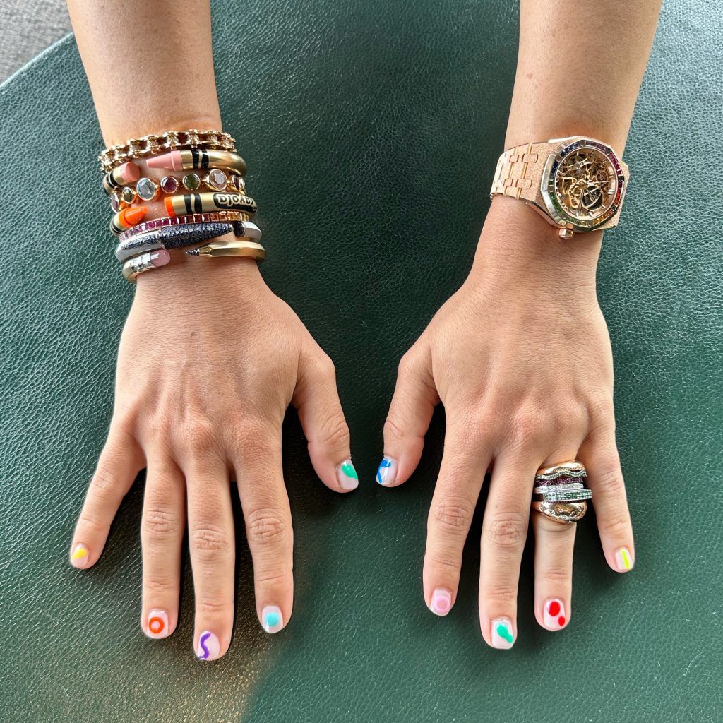 L/R WRIST: Nadine Ghosn pairs an insane openworked rainbow-sapphire Royal Oak