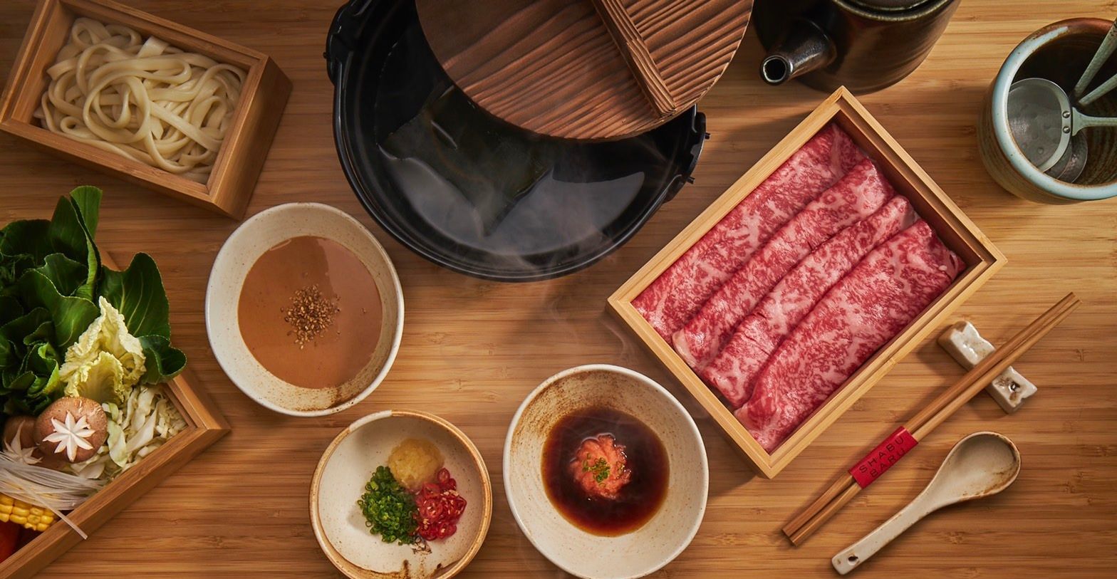 Split pot-one side for Sukiyaki and the other for Shabu Shabu