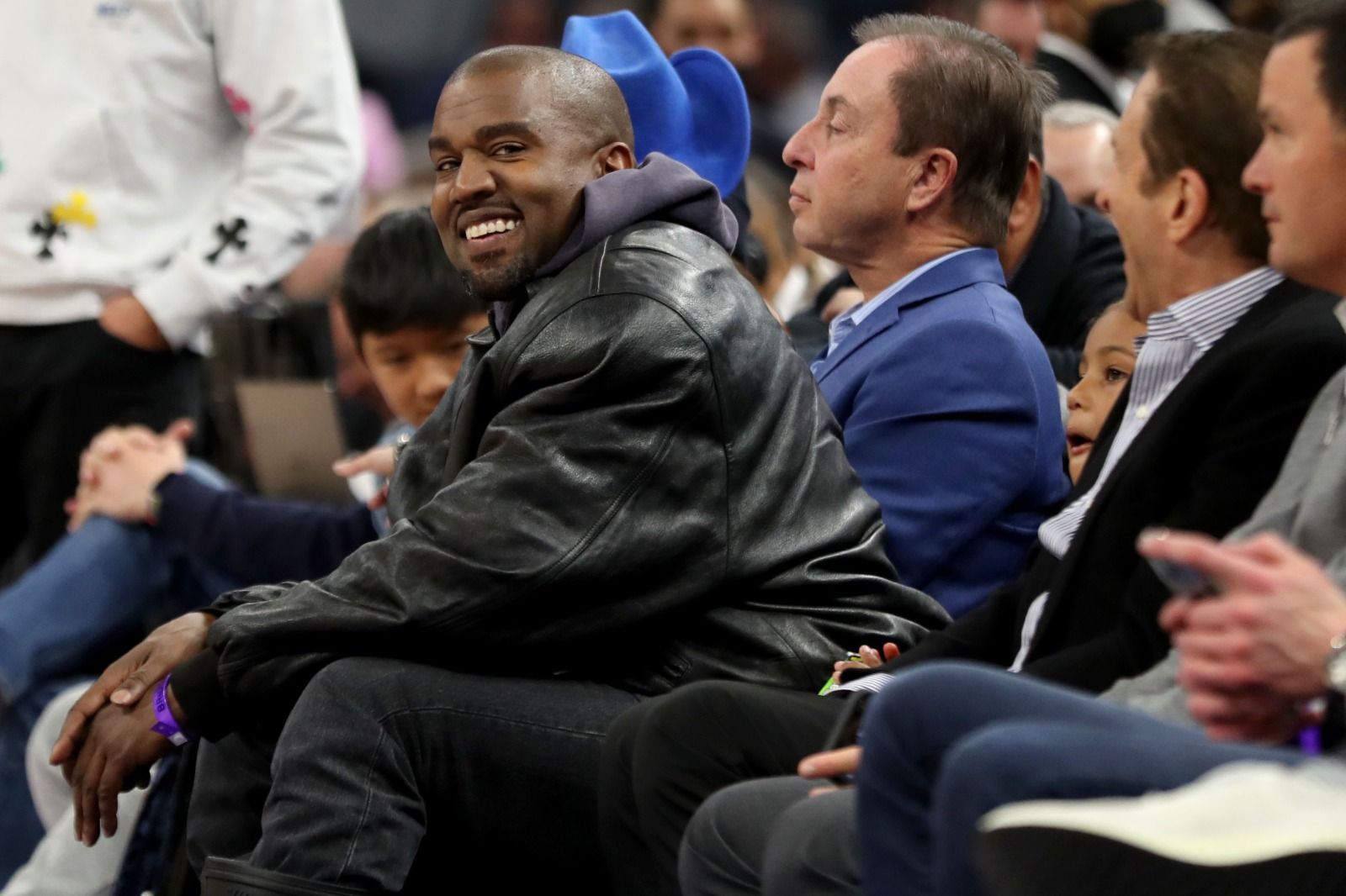 SAN FRANCISCO, CALIFORNIA - MARCH 16: Kanye West, left, and his son, Saint West, got front row seats next to Golden State Warriors co-owners Joe Lacob and Peter Guber as they watch the game against the Boston Celtics in the second quarter at Chase Center in San Francisco, Calif., on Wednesday, March 16, 2022. (Photo by Ray Chavez/MediaNews Group/The Mercury News via Getty Images)