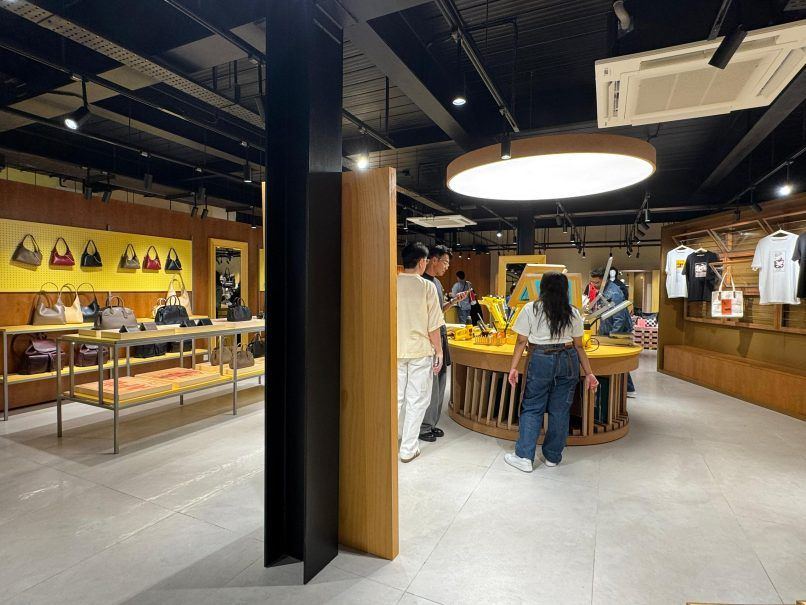 a wide angle shot of the interior of the latest coach boutique in apw bangsar