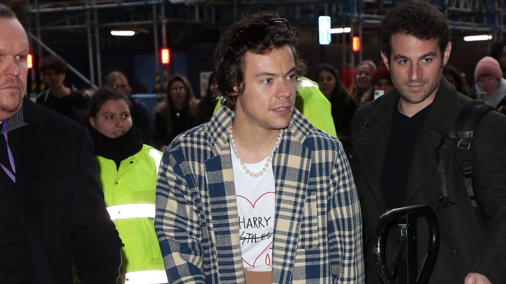 Whether dressed in a casual sweater or a formal blazer, Harry Styles pulls off his favourite accessory, the classic pearl necklace. (Photo credit: Getty Images)