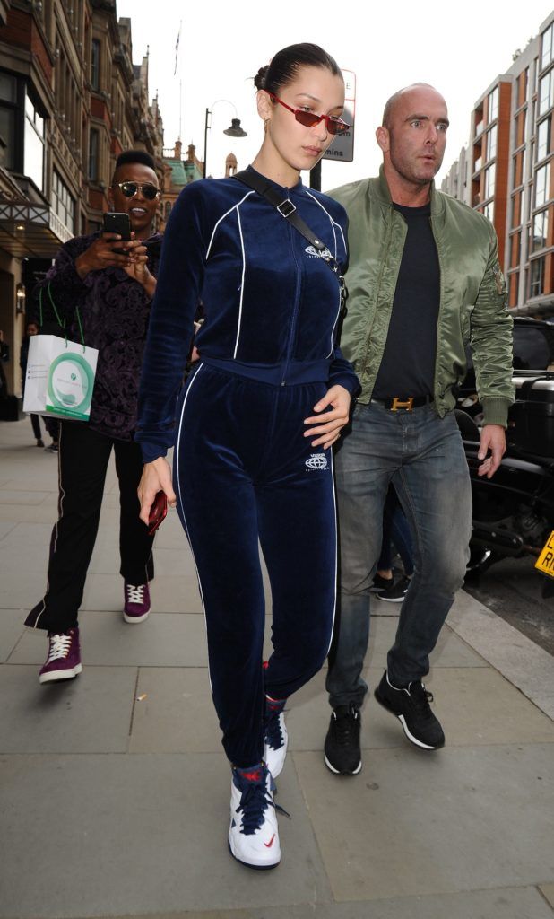 Bella Hadid wore a Visitor on Earth tracksuit to London Fashion Week in 2017. (Photo credit: Splash News)