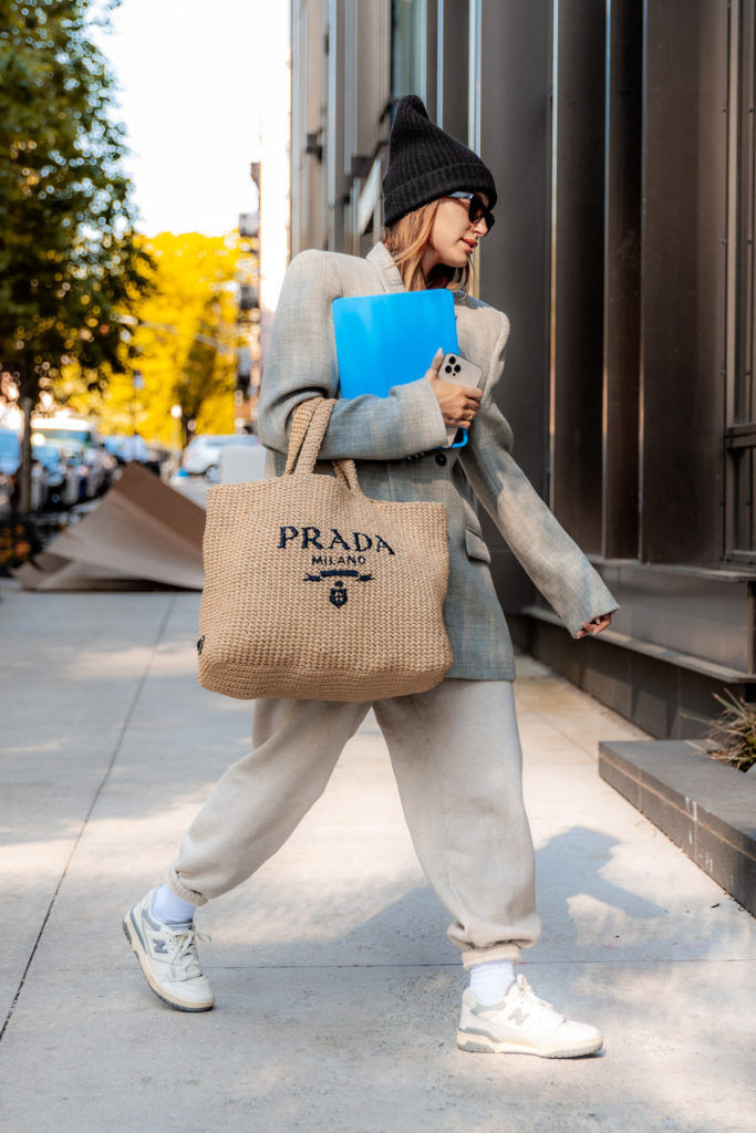 Hailey Bieber with the Prada raffia tote bag. (Photo credit: Splash News)