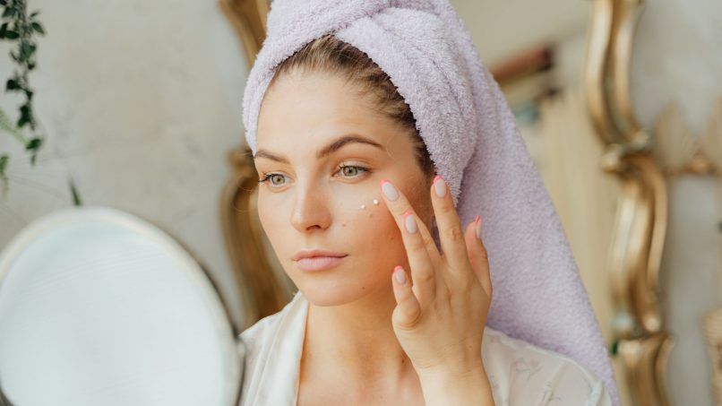Woman tending to dry skin