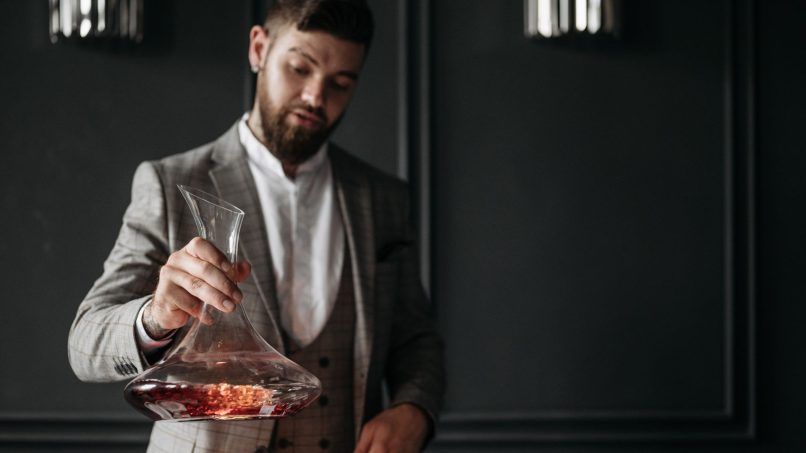 Man holding a wine decanter