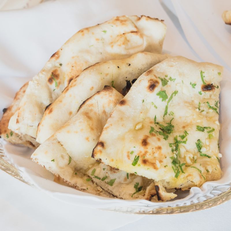 3 fool-proof recipes for garlic naan, according to tandoor chefs