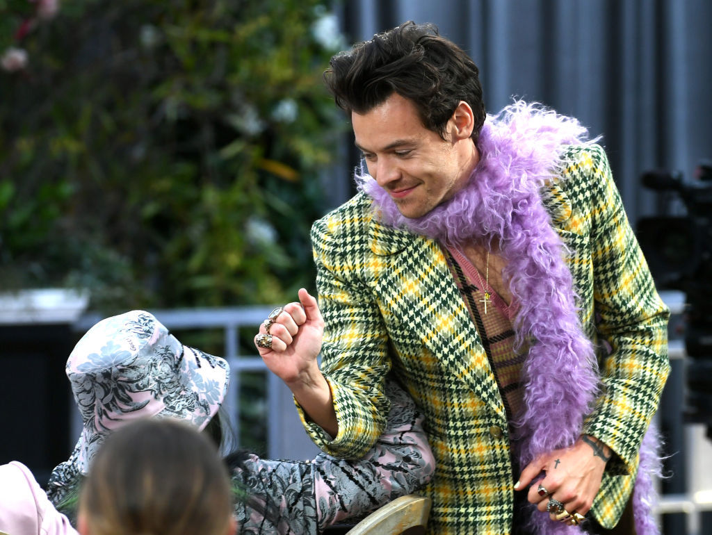 It’s official! Harry Styles is bringing back the coolest accessory ever, the feather boa
