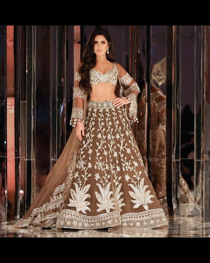 katrina kaif brown dress Katrina - Wearing a dress & holding one. Don't ask me why! VOGUE India