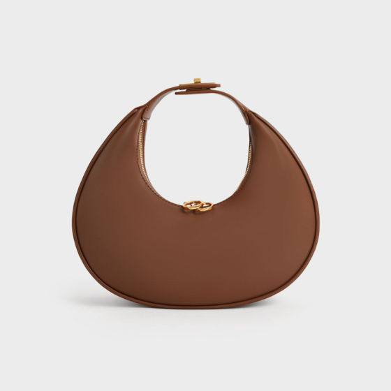 The It-Girls Are Trading Their Minimalist Half Moon Bags For This Playful  Alternative