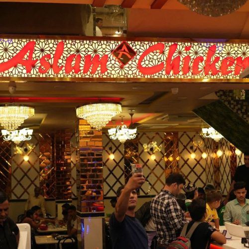 Savour a bowl of juicy chicken dunked in butter at Aslam Chicken near Jama Masjid